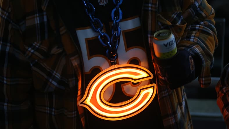 A Chicago Bears fan in 2024 with a necklace