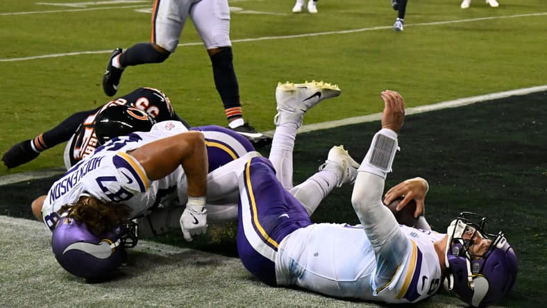 J.J. McCarthy runs for a touchdown against the Bears at Soldier Field. Vikings QB battle