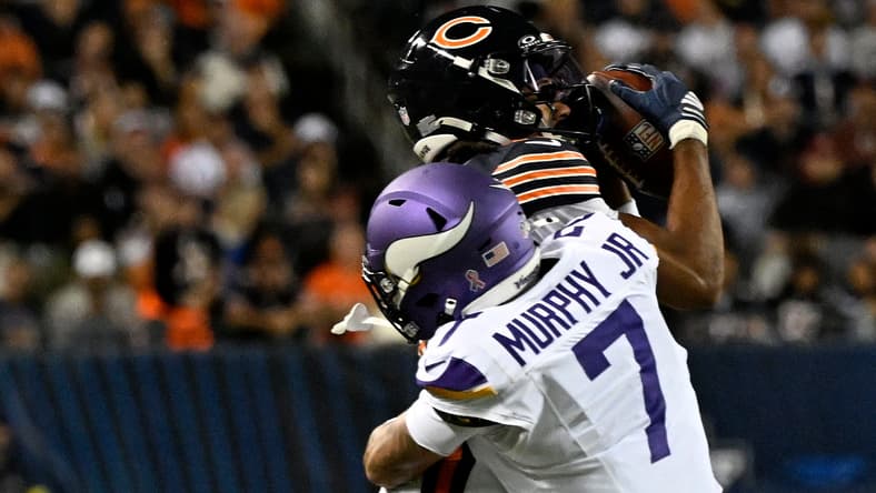 Rome Odunze makes a catch against the Vikings during the first half at Soldier Field.