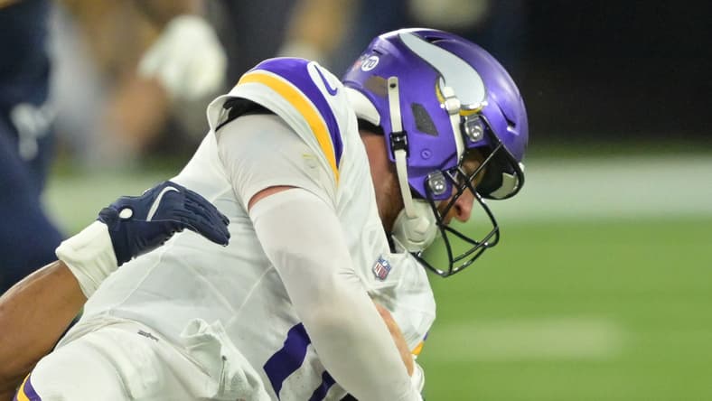 Vikings QB Carson Wentz sacked in 2025 at Los Angeles.
