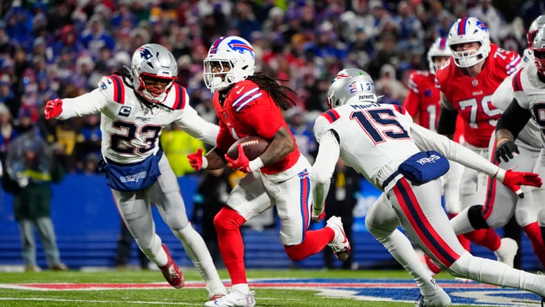 Patriots safety Kyle Dugger pursues Bills RB James Cook.