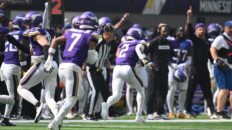 Minnesota Vikings cornerback Isaiah Rodgers runs with the ball after intercepting a pass and scoring a touchdown against the Cincinnati Bengals at U.S. Bank Stadium..
