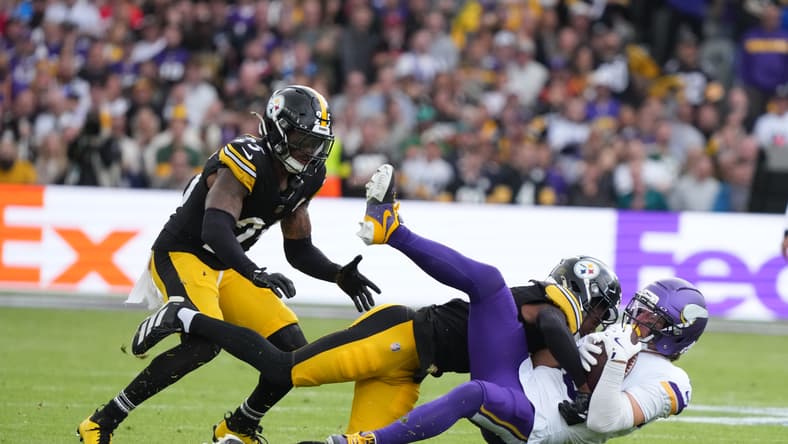 Adam Thielen is tackled by Steelers defenders during the Vikings’ International Series game in Dublin.