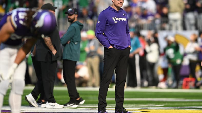 Kevin O’Connell watching pregame warmups on the sideline before a Vikings game against the Eagles
