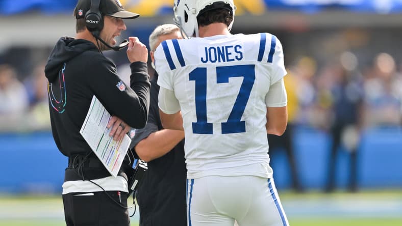 Daniel Jones speaks with Shane Steichen during a Colts game against the Chargers. 2026 NFL predictions