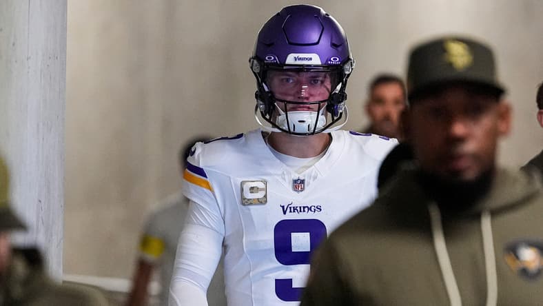 J.J. McCarthy walks through the tunnel before a Vikings game against the Lions at Ford Field.