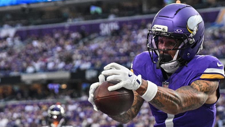 Jalen Nailor catches a touchdown while defended by Nate Wiggins during the Vikings’ game against the Ravens.