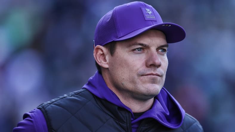 Kevin O’Connell watches warmups before a Vikings game against the Seattle Seahawks.