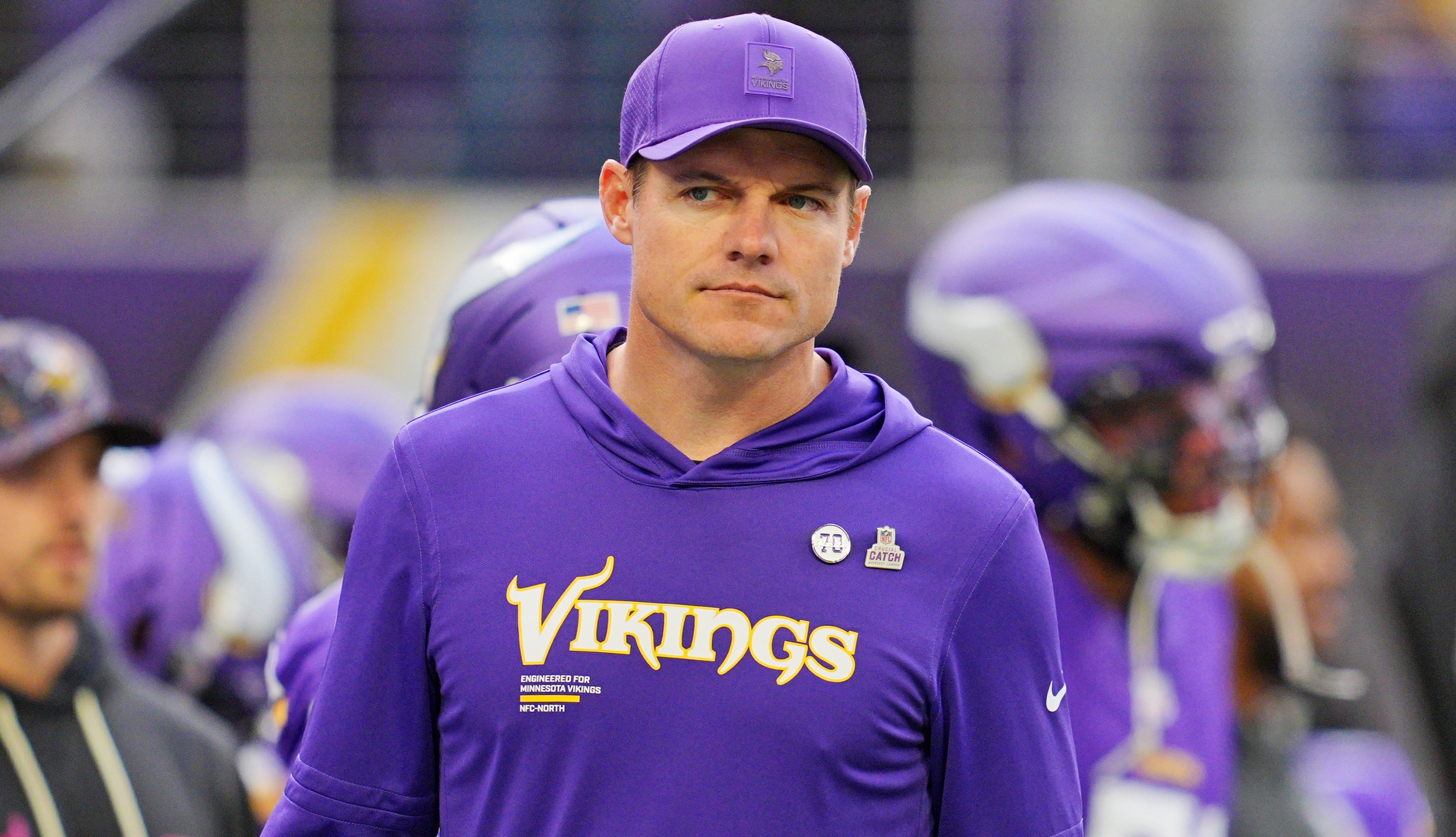 Vikings head coach Kevin O’Connell watches pregame warmups before a game against the Philadelphia Eagles at U.S. Bank Stadium.