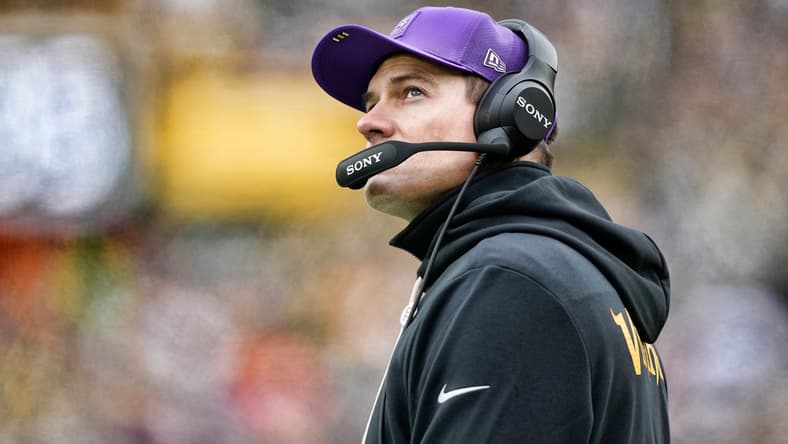 Kevin O’Connell stands on the sideline during a game at Lambeau Field