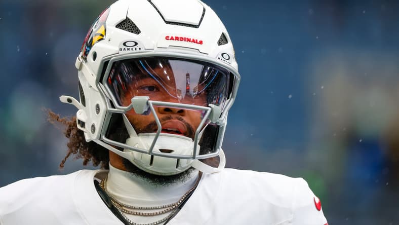Cardinals quarterback Kyler Murray warms up before a road game against the Seattle Seahawks. Vikings quarterback battle