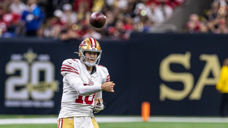 San Francisco 49ers quarterback Mac Jones throws a pass against the New Orleans Saints during an NFL game at Caesars Superdome.
