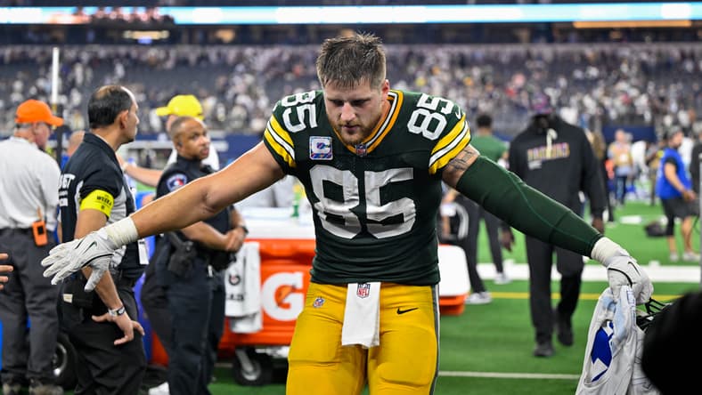 Tucker Kraft walks off the field after a Packers game against the Cowboys.