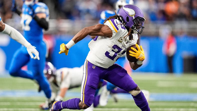 Aaron Jones Sr. runs with the football against the Detroit Lions at Ford Field.