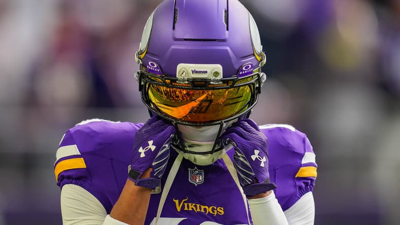 Justin Jefferson warms up before facing the Ravens at U.S. Bank Stadium.