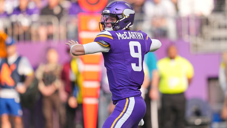 J.J. McCarthy throws a pass against the Bears at U.S. Bank Stadium.