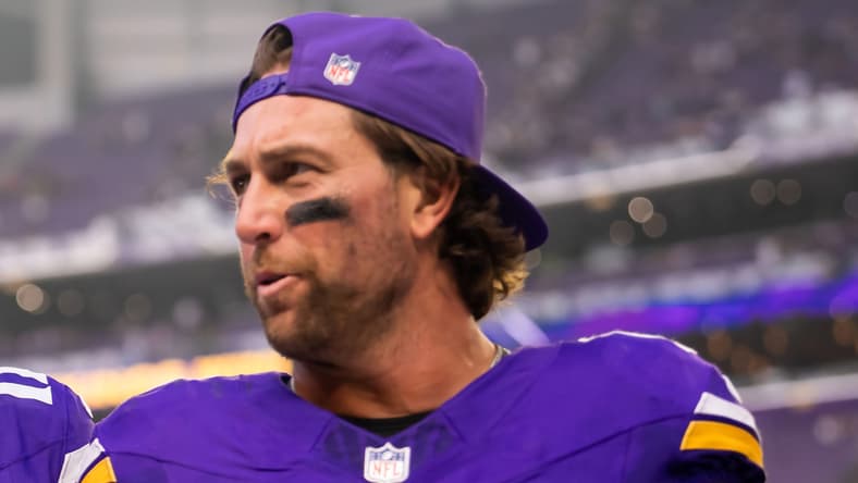 Max Brosmer and Adam Thielen leave the field after facing Cincinnati.