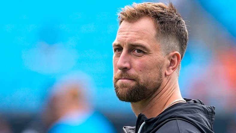Adam Thielen warms up on the field before a game with the Panthers.