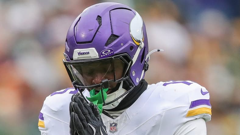 Dallas Turner celebrates sack of Jordan Love at Lambeau Field.