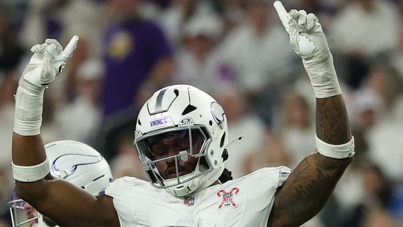 Dallas Turner celebrates a defensive stop against the Lions while Jared Goff reacts during a game in Minneapolis. Vikings breakout candidates