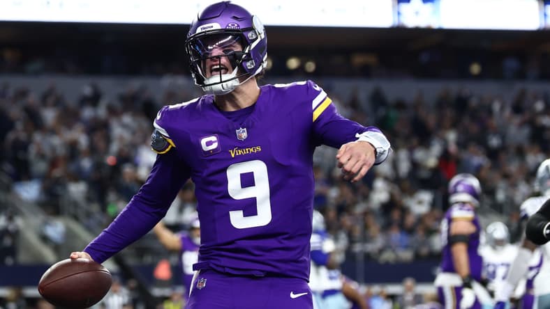 J.J. McCarthy celebrating a touchdown during a Vikings game against the Cowboys at AT&T Stadium