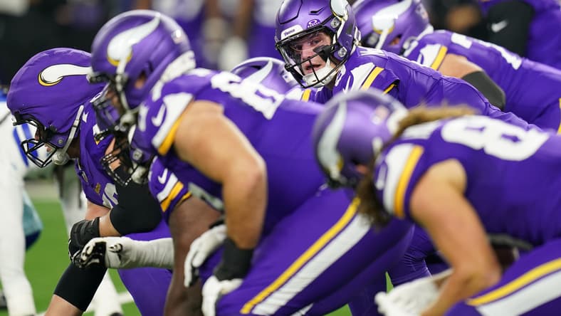 J.J. McCarthy calls signals during a Vikings game against the Dallas Cowboys at AT&T Stadium.
