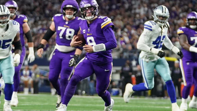 J.J. McCarthy scrambles outside the pocket during a Vikings road game against the Dallas Cowboys at AT&T Stadium.