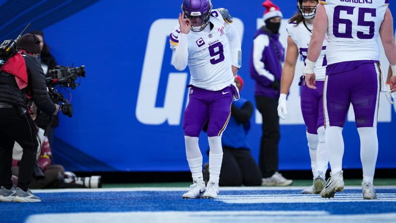 J.J. McCarthy celebrates after scoring a touchdown against the New York Giants at MetLife Stadium.