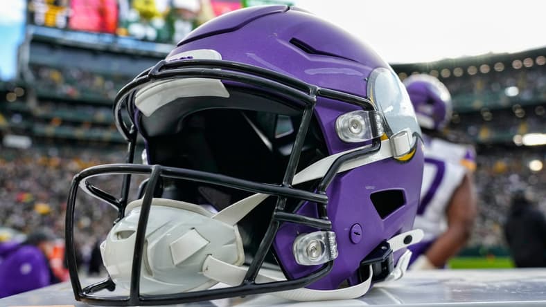 Minnesota Vikings helmet resting on the sideline at Lambeau Field before a game against the Packers.