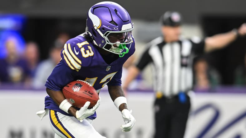 Vikings wide receiver Tai Felton returning the ball against the Packers at U.S. Bank Stadium