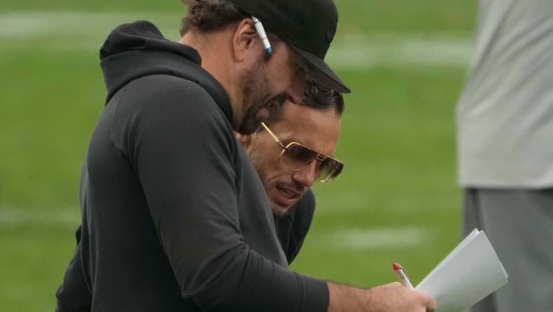 Frank Smith and Mike McDaniel speak during Miami Dolphins practice in Frankfurt, Germany. Vikings QB battle