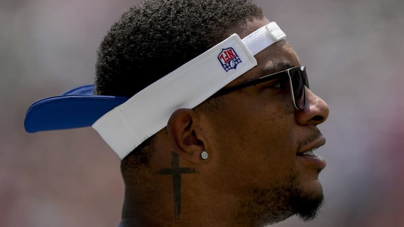 Colts quarterback Anthony Richardson walks the sideline before a preseason game against the Bengals.