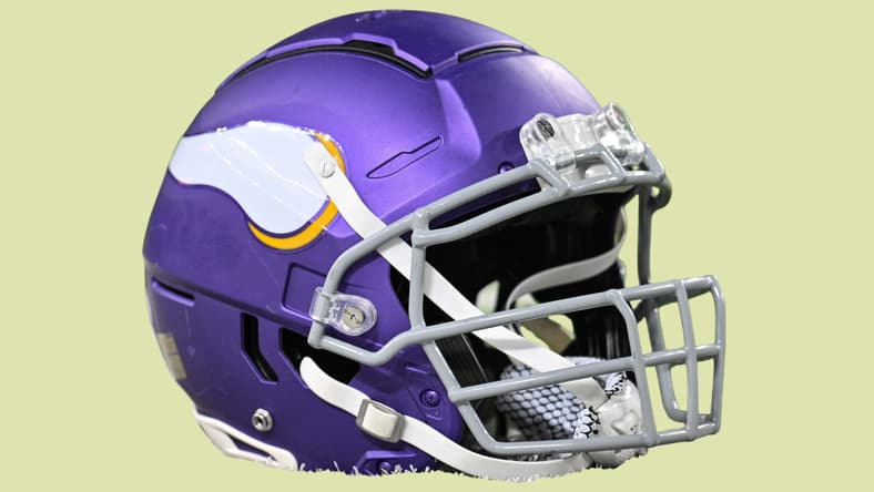 Minnesota Vikings helmet sits on the field before a game at U.S. Bank Stadium.