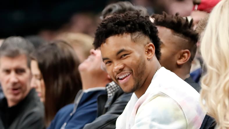 Kyler Murray watches courtside during a Mavericks versus Suns NBA game at American Airlines Center. Vikings offseason