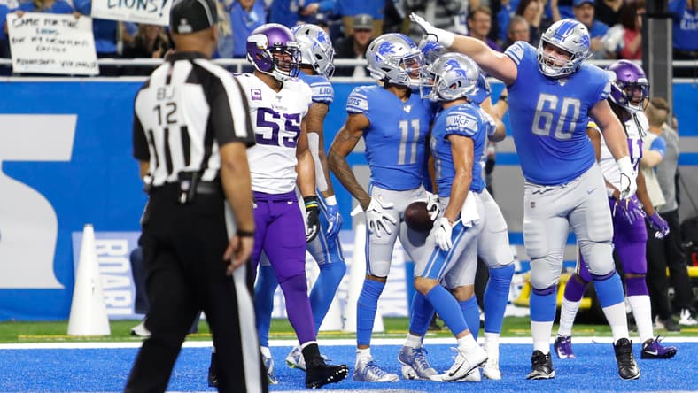 Lions center Graham Glasgow celebrates a touchdown against the Vikings