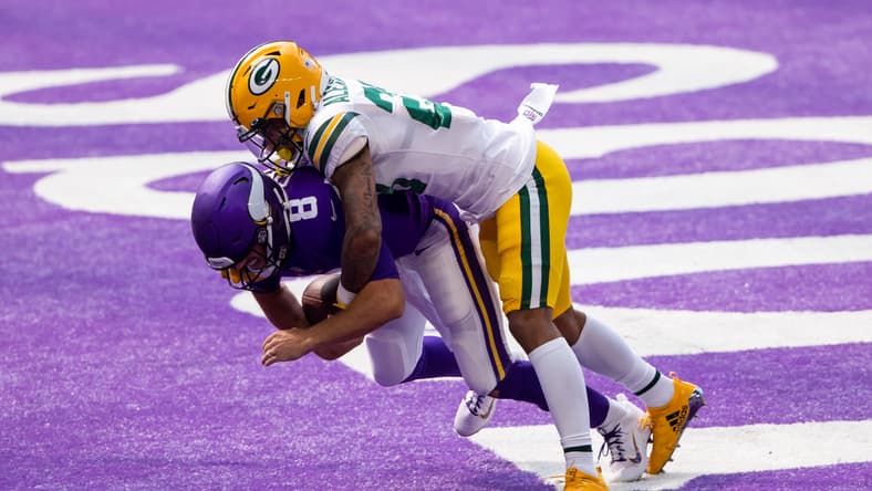 Jaire Alexander sacks Kirk Cousins in the end zone for a safety at U.S. Bank Stadium