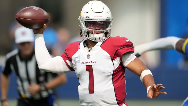 Kyler Murray throwing a pass during a Cardinals game against the Los Angeles Rams at SoFi Stadium.