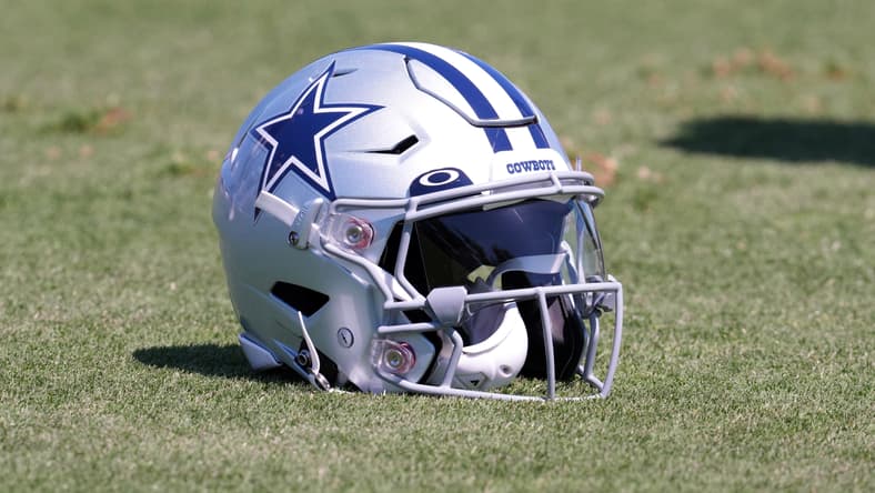 A Dallas Cowboys helmet on the field in 2022