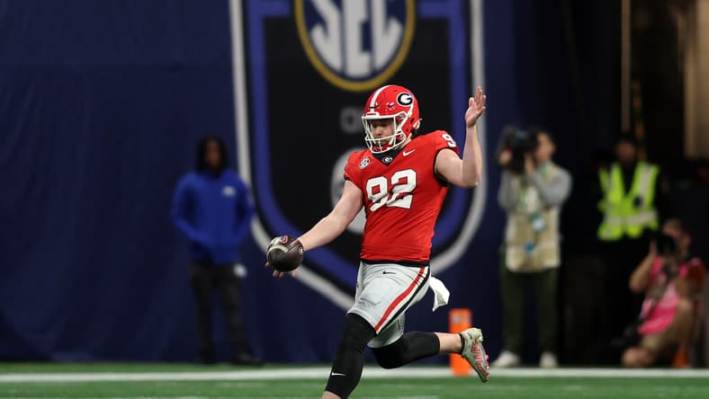 Brett Thorson punts during the SEC Championship game between Georgia and Texas in Atlanta. Vikings predictions