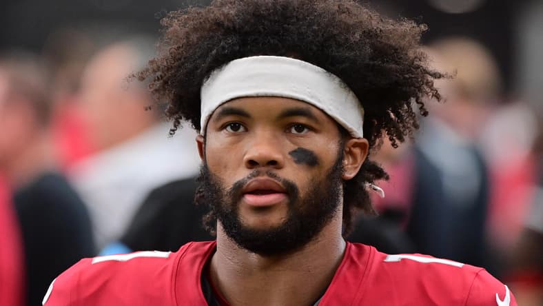 Kyler Murray looks on during pregame warmups before a game against the Rams at State Farm Stadium.