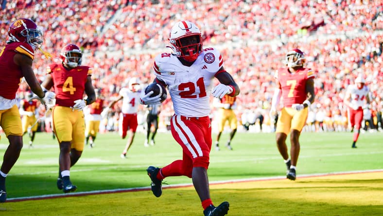Emmett Johnson scores a touchdown during a game against USC at the Los Angeles Memorial Coliseum.