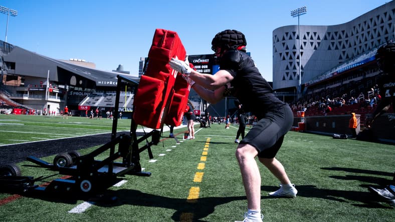 Cincinnati linebacker Jake Golday participates in a drill during spring football practice at Nippert Stadium.