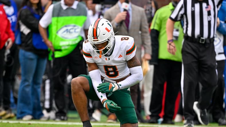 Jakobe Thomas lies on the field after an injury during a Miami game against SMU.