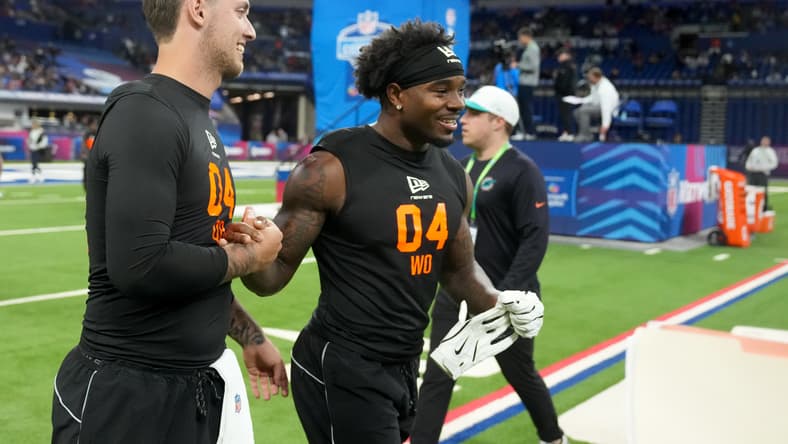 Miami quarterback Carson Beck walks with Georgia wide receiver Dillon Bell during the NFL Scouting Combine. Vikings breakout players