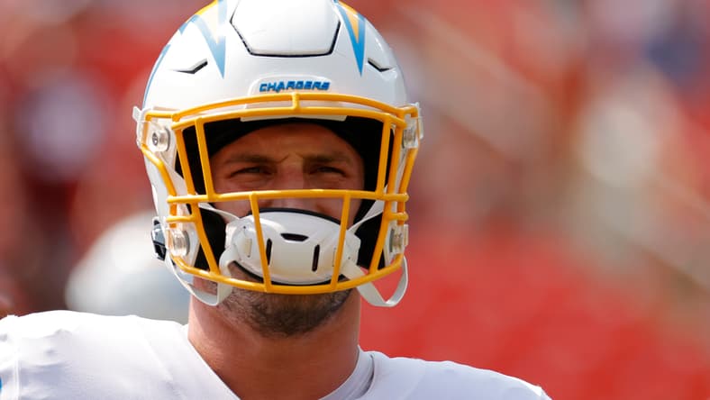 Joey Bosa stands on the field during pregame warmups before a Chargers road matchup in Washington.