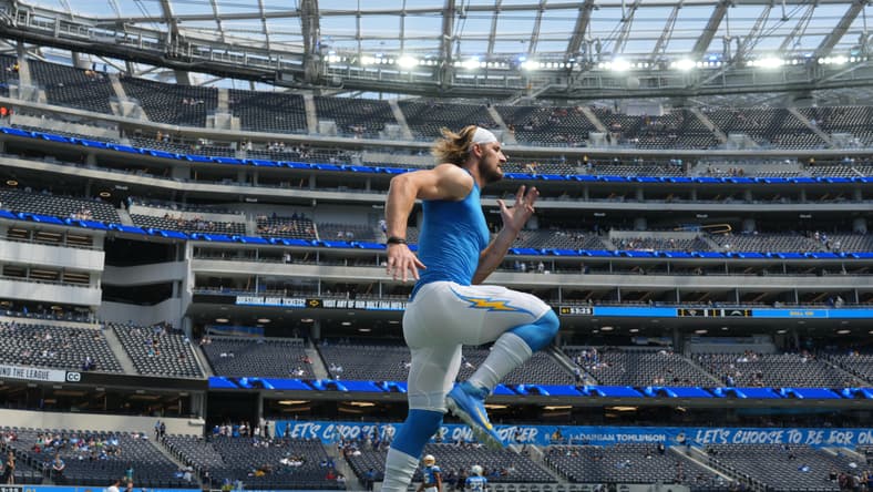 Joey Bosa runs on the field before a Chargers home game at SoFi Stadium against the Jaguars.