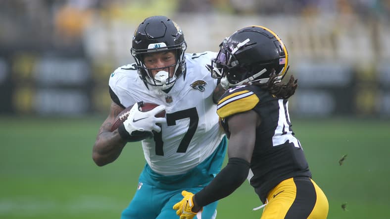 Steelers cornerback James Pierre tackles Jaguars tight end Evan Engram during a game at Acrisure Stadium.