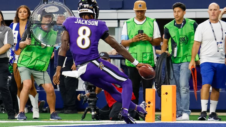 Lamar Jackson reaches for a touchdown during a Ravens game against the Cowboys at AT&T Stadium. Lamar Jackson trade