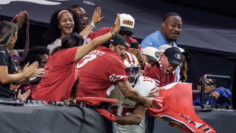 49ers wide receiver Jauan Jennings celebrates a touchdown with fans at Caesars Superdome in New Orleans.