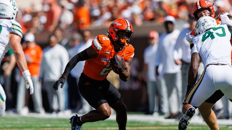 Oklahoma State wide receiver Terrill Davis runs with the football during a game at Boone Pickens Stadium.